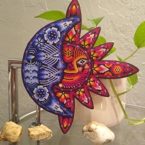 This is a wooden sun and moon